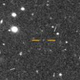 An image of FarFarOut, located between the yellow crosshairs.